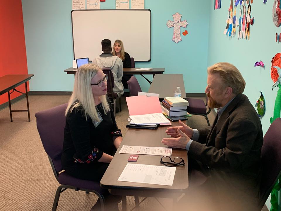 Photo of David Braughler, President and CEO of Braughler Books, working one-on-one with an attendee at the Ohio Christian Writers Conference