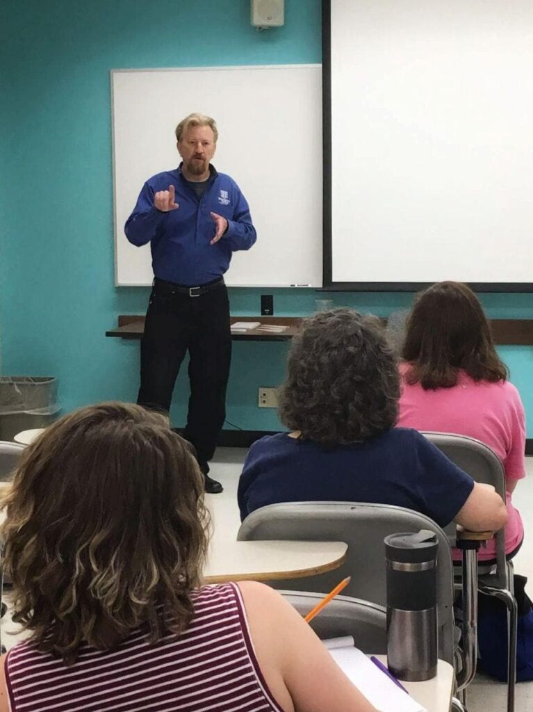 Photo of David Braughler, President and CEO of Braughler Books, presenting at the 33rd annual Antioch Writers Workshop